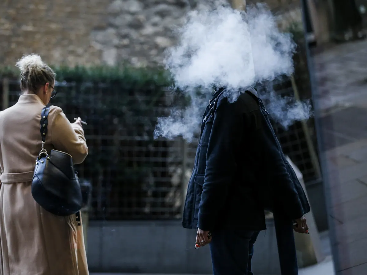 people admiring unique vape, social vaping conversation, stylish e-cigarette discussion - The great vape debate: are e-cigarettes saving smokers or creating ...