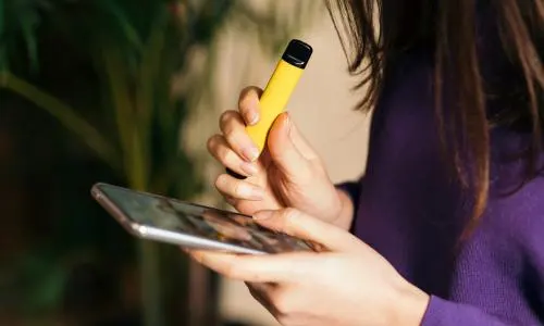 vaping in Australia, rooftop bar Melbourne, Bondi Beach sunset BBQ, modern vape lifestyle, sleek vape device in hand - The vaping industry preyed on young Australians with a flood of ...