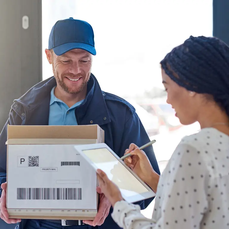 delivery driver exchanging package for cash, customer paying cash on delivery at door, physical verification delivery - What is Cash on Delivery (CoD) and How Does it Work? | Versapay