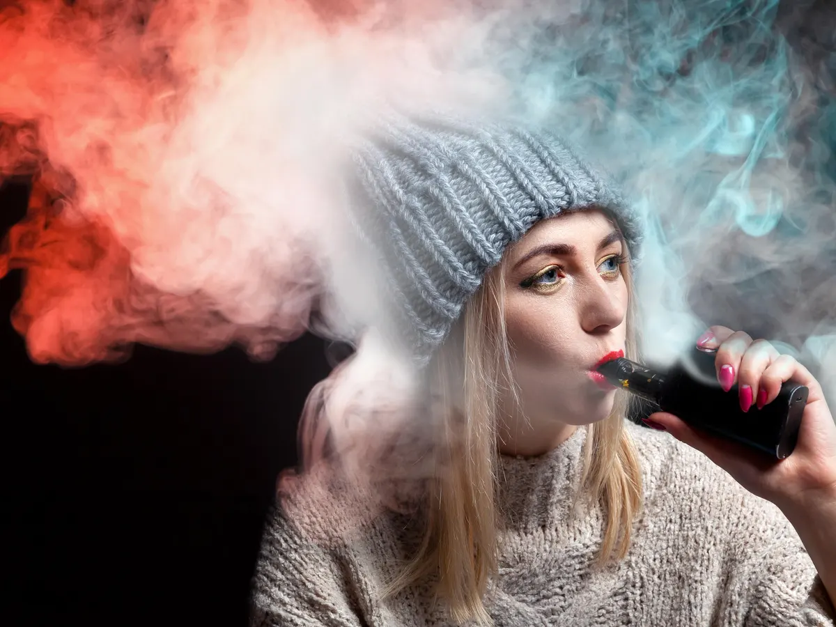 vape as fashion accessory, stylish vape lifestyle, vape on display with tech - Fashion Trends: Is Vaping Now a Style Accessory? - Fashion Bomb Daily