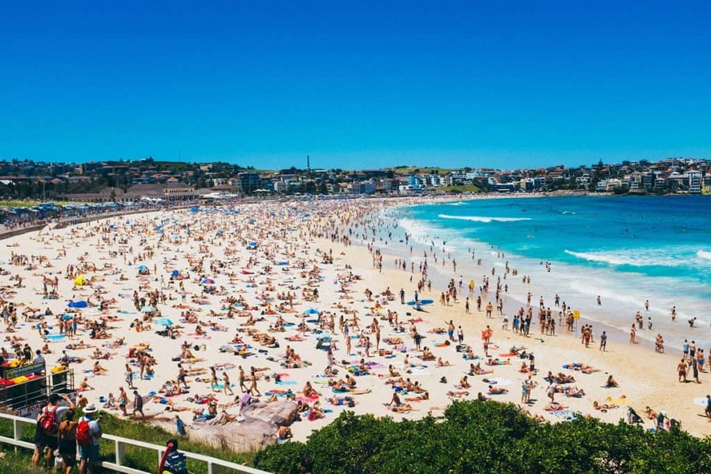 Bondi Beach summer, scorching hot day, Australia beach lifestyle, people relaxing by ocean - Bondi Beach Facts - Bondi 38 Serviced Apartments