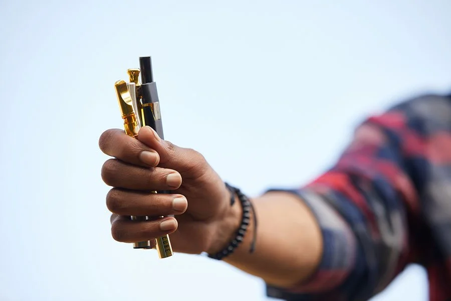 person frustrated with dead vape, disposable vape battery empty unexpectedly, no screen vape problem - Why My Disposable Vape Pen Died Before Empty? And Fix It!