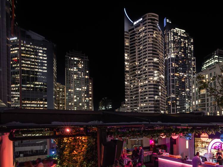 vaping in Australia cityscape golden hour, person relaxing balcony city view vape, beginner vape user Sydney Melbourne - Best Disposable Vapes Australia 2026: Alibarbar Ingot & More