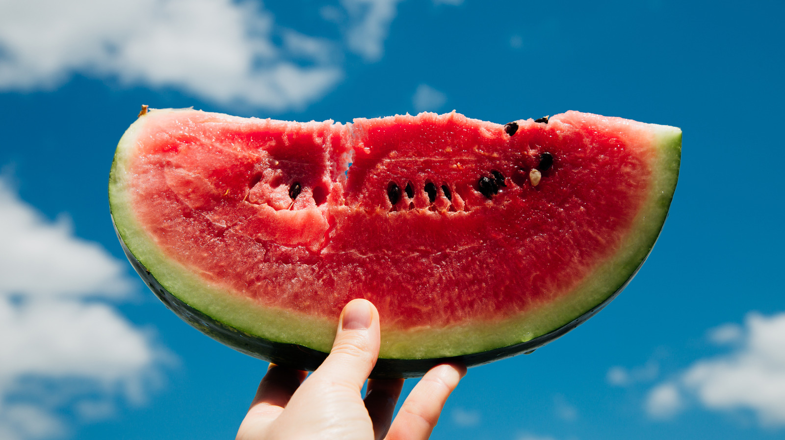Ripe chilled watermelon slice close up, Refreshing summer fruit experience - Tricks For Buying The Perfect Watermelon You